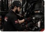 Technician carrying out preventive forklift maintenance